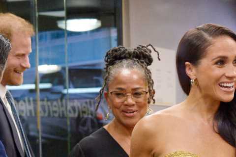Meghan Markle dazzles as she arrives with Prince Harry &amp; mum Doria at glitzy awards show to..
