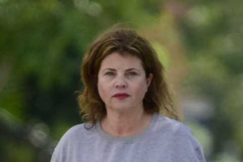 Baywatch babe Yasmine Bleeth looks unrecognisable from her iconic red swimsuit days as she steps..