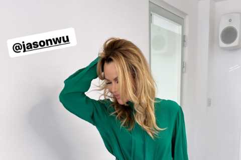 Amanda Holden looks incredible as she poses in green leather trousers and figure-hugging shirt