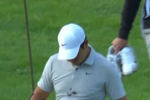 Golf fans in hysterics as Tom Kim falls in mud before going topless after wayward shot into creek..