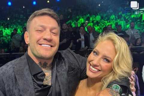 Ebanie Bridges stuns in low cut dress as she gets up close and personal with Conor McGregor at..
