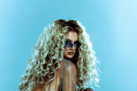 Love Island’s Tasha Ghouri looks almost unrecognisable as she poses topless on incredible shoot