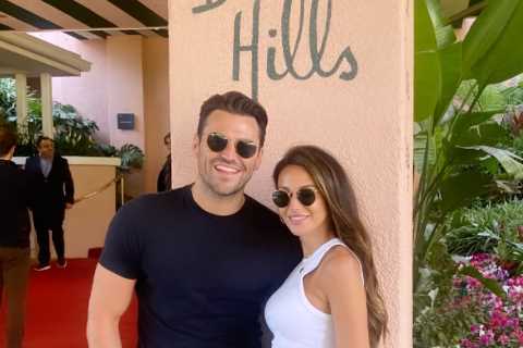 Michelle Keegan and Mark Wright toast their wedding anniversary as they pose at VERY famous hotel