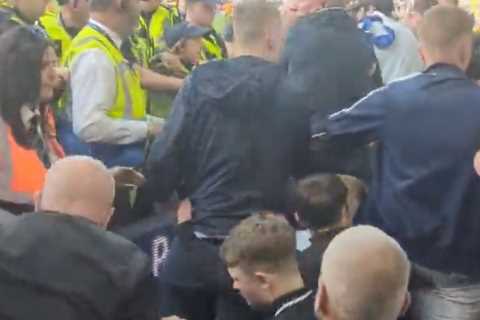 Shocking moment chaos erupts at Leeds United as fans clash with police following relegation from..