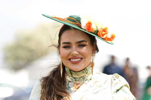 Glam racegoers pull out all the style stops as they arrive for Derby Day at Epsom Downs racecourse