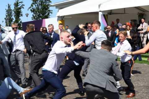 Epsom Derby: Huge fight breaks out at racecourse with boozed-up revellers throwing punches in..