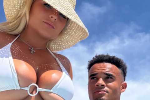Busty ring girl Apollonia Llewellyn risks wardrobe malfunction as she shows off major underboob..