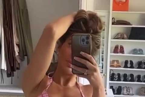 Chloe Ferry sizzles in tiny pink bikini as she admires her curves in her dressing room