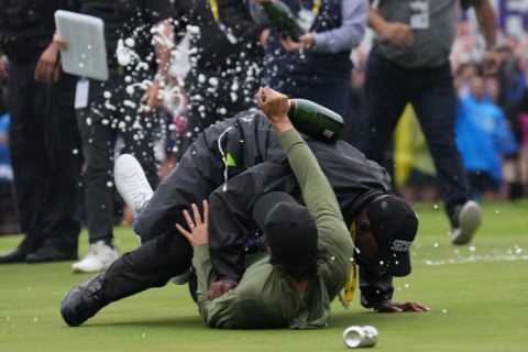 Watch pro golfer ranked top 70 in world get TACKLED by security guard who mistakes him for a fan as ..