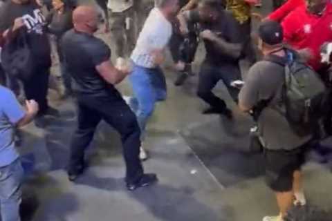 Watch insane mass brawl break out in crowd at Mayweather vs Gotti III as men wildly swing at each..