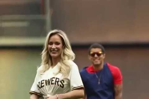 Paige Spiranac stuns baseball fans in unbuttoned shirt as she throws the first pitch at the..
