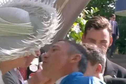 Moment jockey Frankie Dettori breaks Royal protocol by giving Camilla a kiss as he’s swept up in..