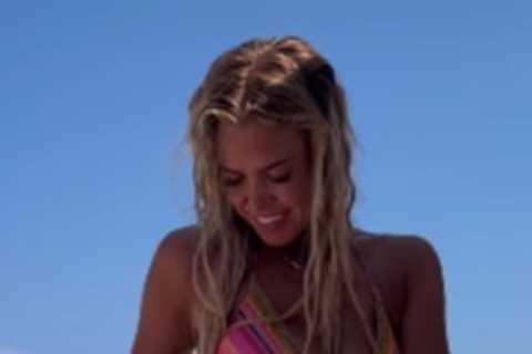 Chloe Meadows strips down to a bikini as she relaxes by the pool amid drama on Towie away trip