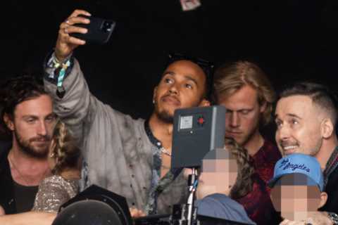 F1 star Lewis Hamilton flies to Glastonbury in helicopter to watch Elton John with his husband..