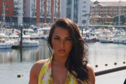 Love Island star Paige Thorne goes braless in plunging summer dress as she enjoys the sun in Cardiff