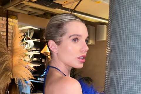 Helen Flanagan stuns as she goes braless as she poses in blue feathered dress