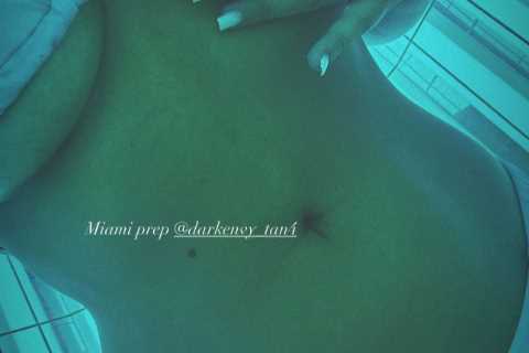 Busty boxing ring girl Apollonia Llewellyn shares boob selfie from inside tanning machine as she..