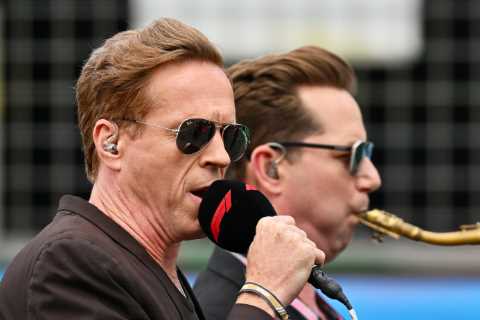 F1 fans absolutely baffled as Hollywood star sings national anthem ‘like Elvis’ alongside a..
