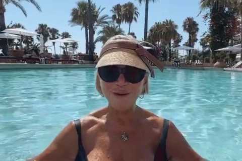 Celebrity psychic Sally Morgan, 71, wows fans as she strips to black swimsuit on holiday
