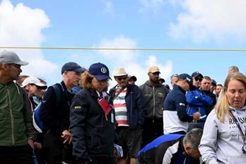 Medics rush to help stricken fan as second supporter is hit by ball at The Open after stray Zach..