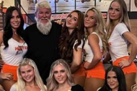 Former Open champion John Daly hangs out in Hooters with host of busty waitresses after missing the ..