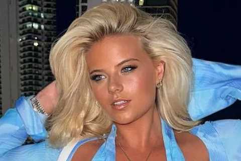Busty ring girl Apollonia Llewellyn bursts out of blue dress and exposes underboob in bikini with..