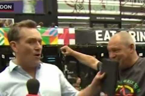 BBC News reporter forced to apologise as football fan interrupts live broadcast with foul-mouthed..
