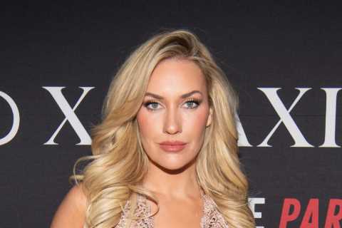 Paige Spiranac looks jaw-dropping in see-through white lingerie and suspenders as she holds jugs..