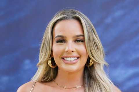 Love Island’s Ella B stuns in plunging white gown as she attends movie premiere without Mitch