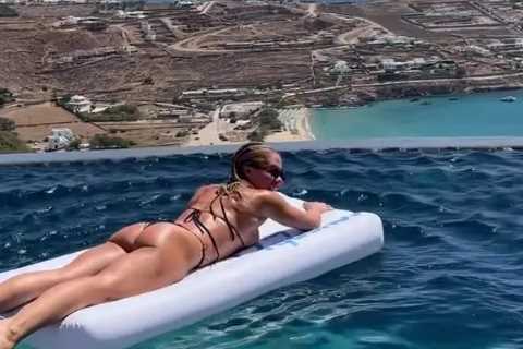 Love Island star Gabby Allen reveals amazing figure as she straddles float in thong bikini on..