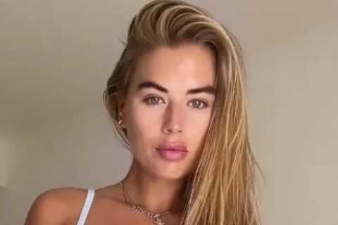 Love Island’s Arabella Chi stuns in see-through white lingerie and suspenders
