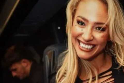 ‘Sexiest boxer ever’ Ebanie Bridges flaunts cleavage in daring outfit as she playfully asks ‘does..