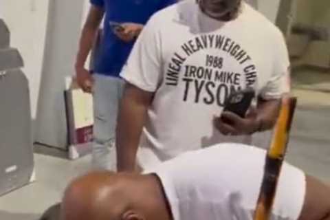 Mike Tyson Gets Up Close and Personal with a Giant Dog in Bizarre Viral Clip