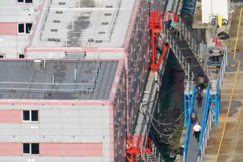 Migrants Return to Barge After Health Officials Clear Deadly Bacteria
