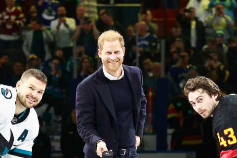 Prince Harry told to drop hockey puck by star as he's too busy smiling for photos