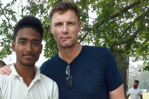 Brave Freddie Flintoff poses with young cricketer a year after horror crash as he films second..