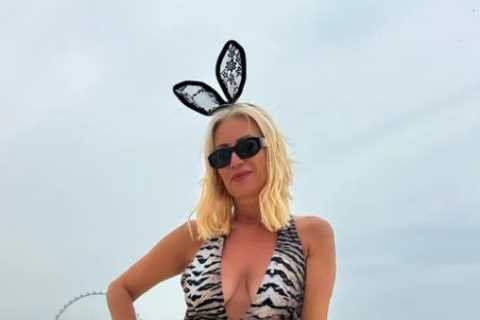 Denise Van Outen stuns in daring animal print swimsuit and bunny ears in Dubai