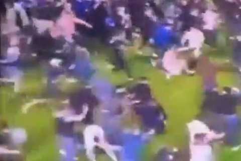 Shocking Moment Portsmouth Fans Allegedly Attack Barnsley Star During Pitch Invasion