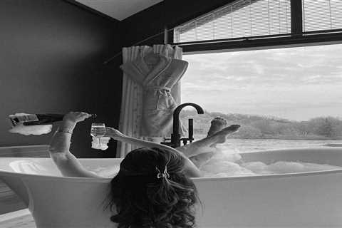 Maura Higgins Enjoys a Luxurious Bath with Champagne Amidst Split