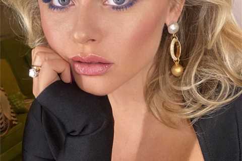 Emily Atack stuns in plunging black top for new TV series selfie